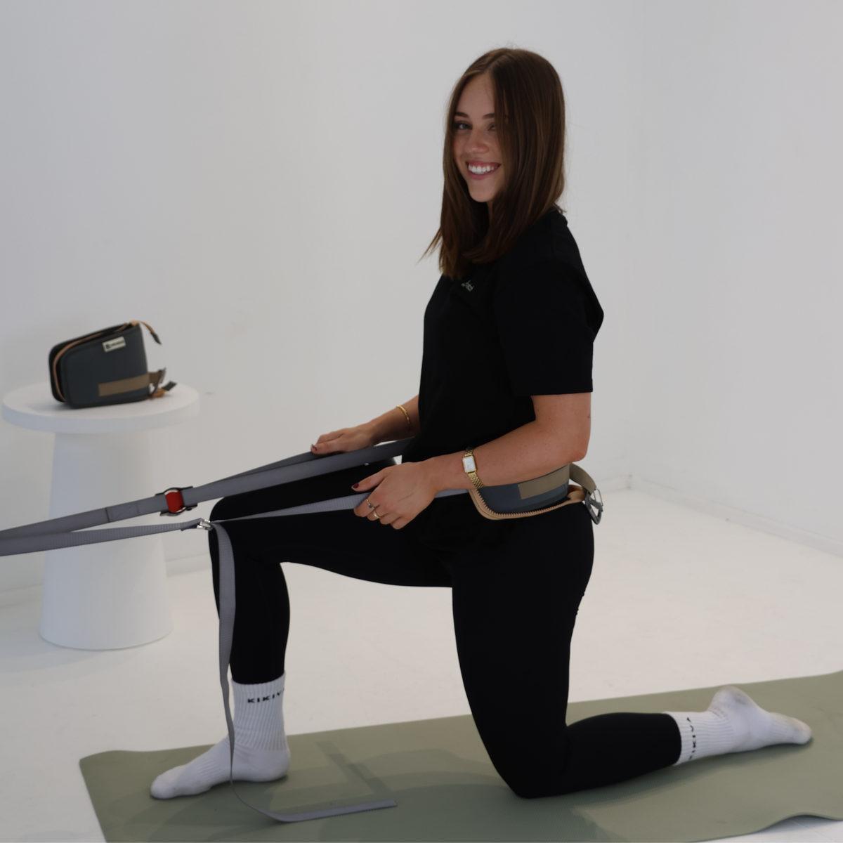Ustretch adjustable stretching and mobility system used for kneeling hip flexor stretch